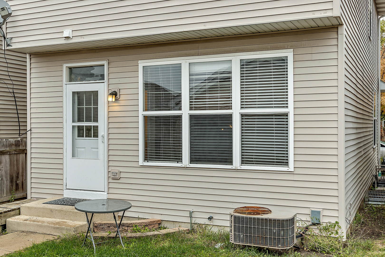 2123 Grayhawk Drive Aurora, IL 60503 - Photo 17 of 18 a front view of a house with a yard and balcony