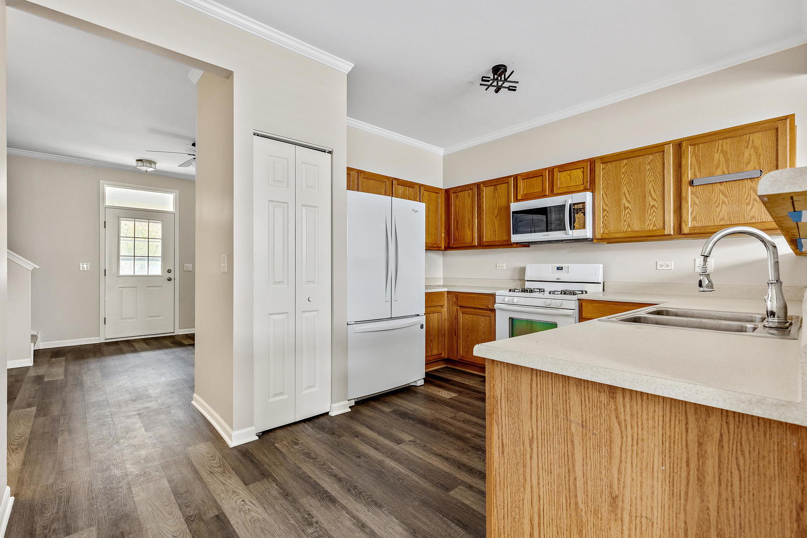 2123 Grayhawk Drive Aurora, IL 60503 - Photo 5 of 18 a kitchen with a refrigerator sink and wooden cabinets