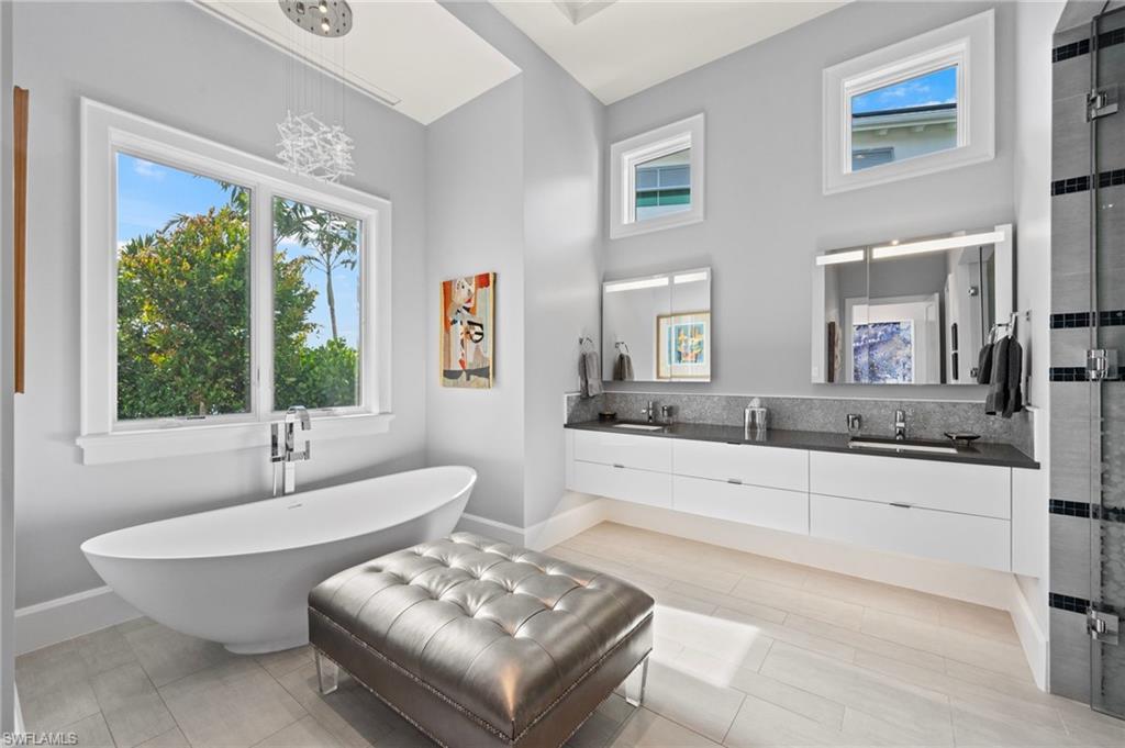 1779 Crayton Road Naples, FL 34102 - Photo 18 of 18 a living room with furniture and a large window