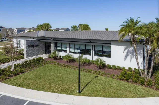 an aerial view of a house with a swimming pool