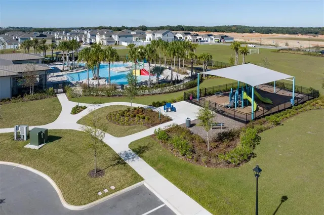 an aerial view of a city and lake view
