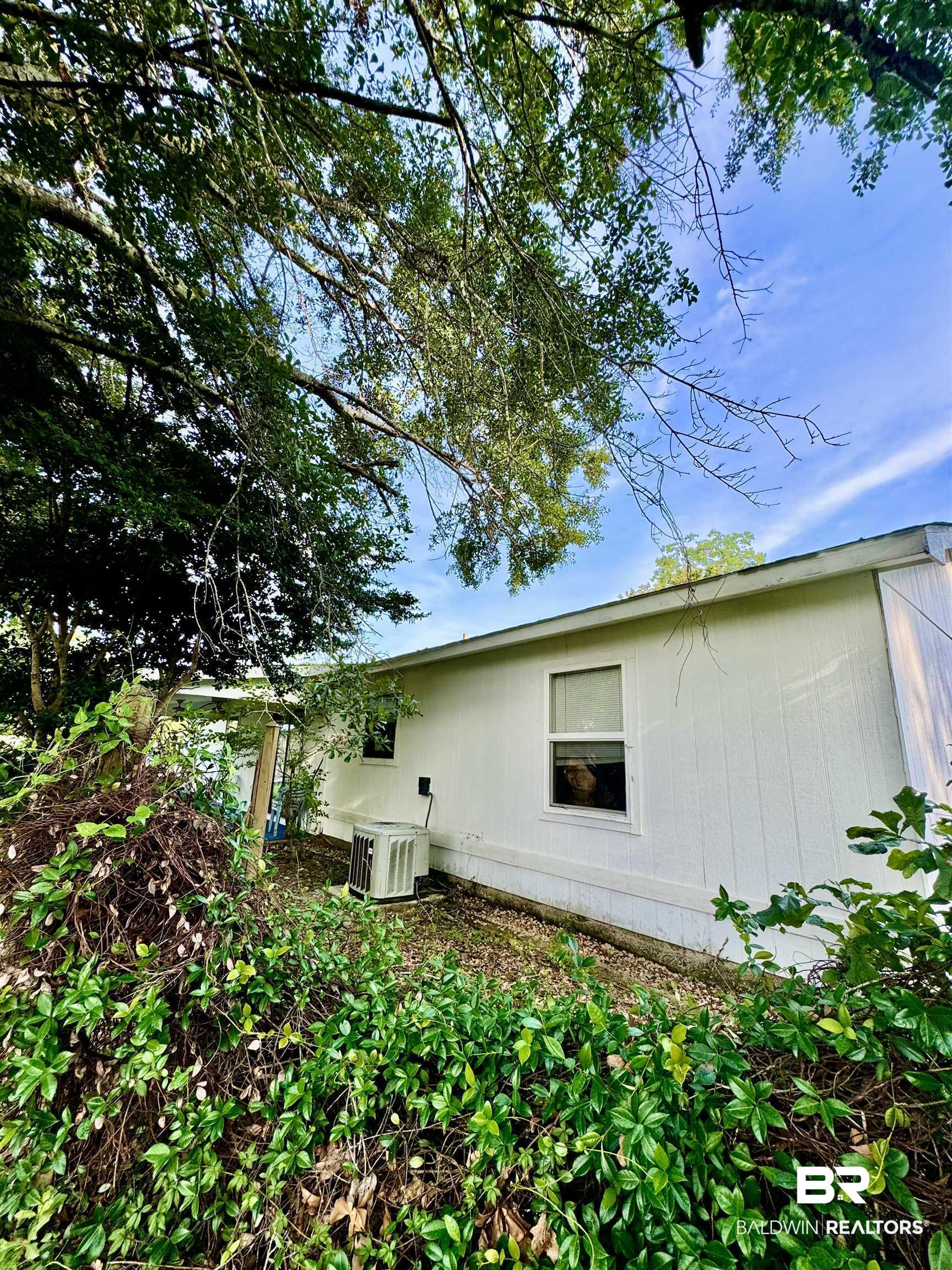 512 Deborah Court Foley, AL 36535 - Photo 5 of 23 View of side of property with central AC