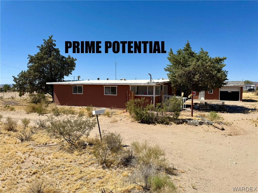 8051 7th Street Dolan Springs, AZ 86441 - Photo 1 of 65 a view of a house with a yard