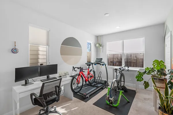 a view of a workspace with furniture