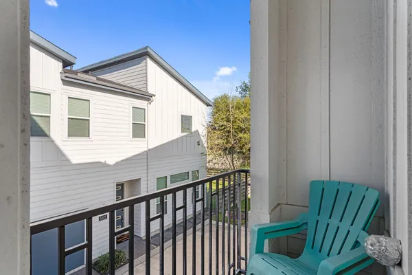 a view of balcony with furniture