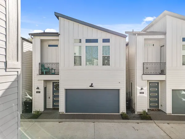 a front view of a house with a garage