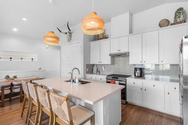 a kitchen with a sink cabinets and window