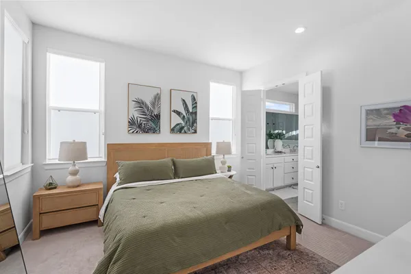 a bedroom with a large bed and a window