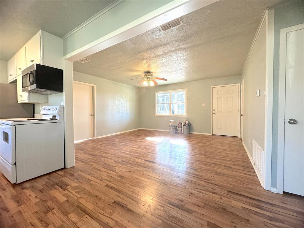 281 Lake Drive Mount Vernon, TX 75457 - Photo 4 of 13 a view of a kitchen cabinets and wooden floor