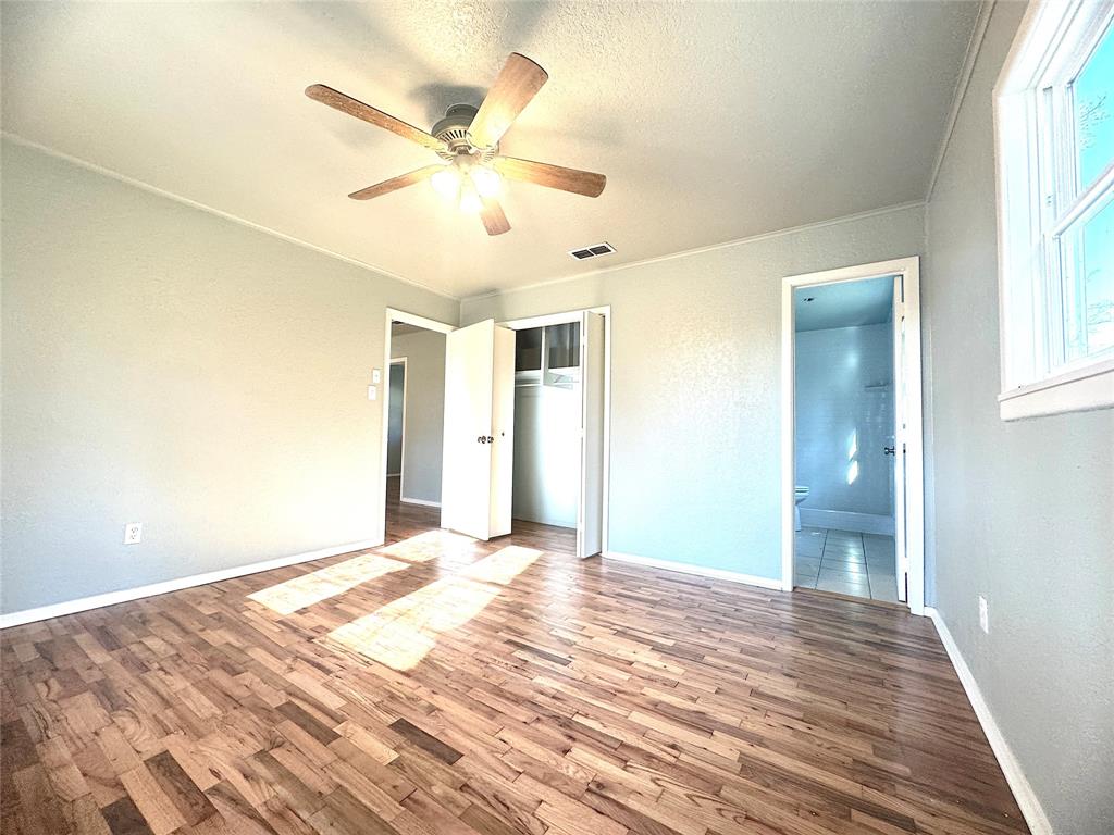 281 Lake Drive Mount Vernon, TX 75457 - Photo 7 of 13 a view of a livingroom with a window and a ceiling fan