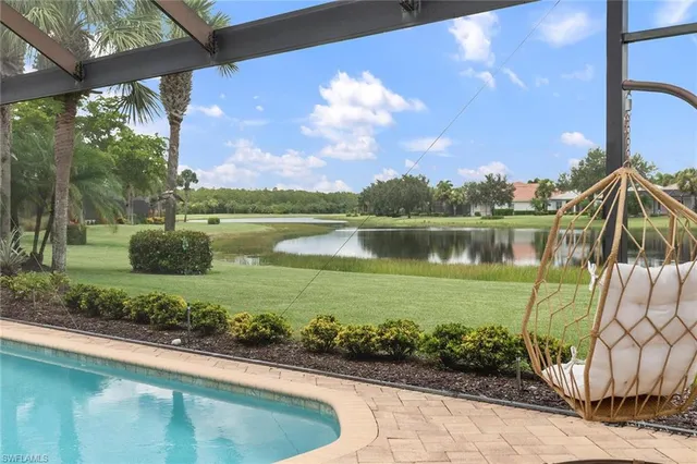 a view of a lake with a house in the background