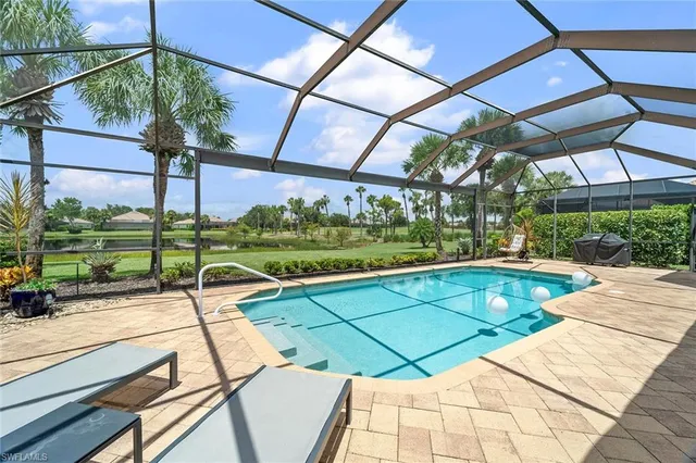 a view of a swimming pool with a patio