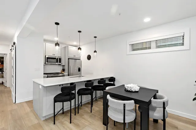 a kitchen with a table and chairs in it