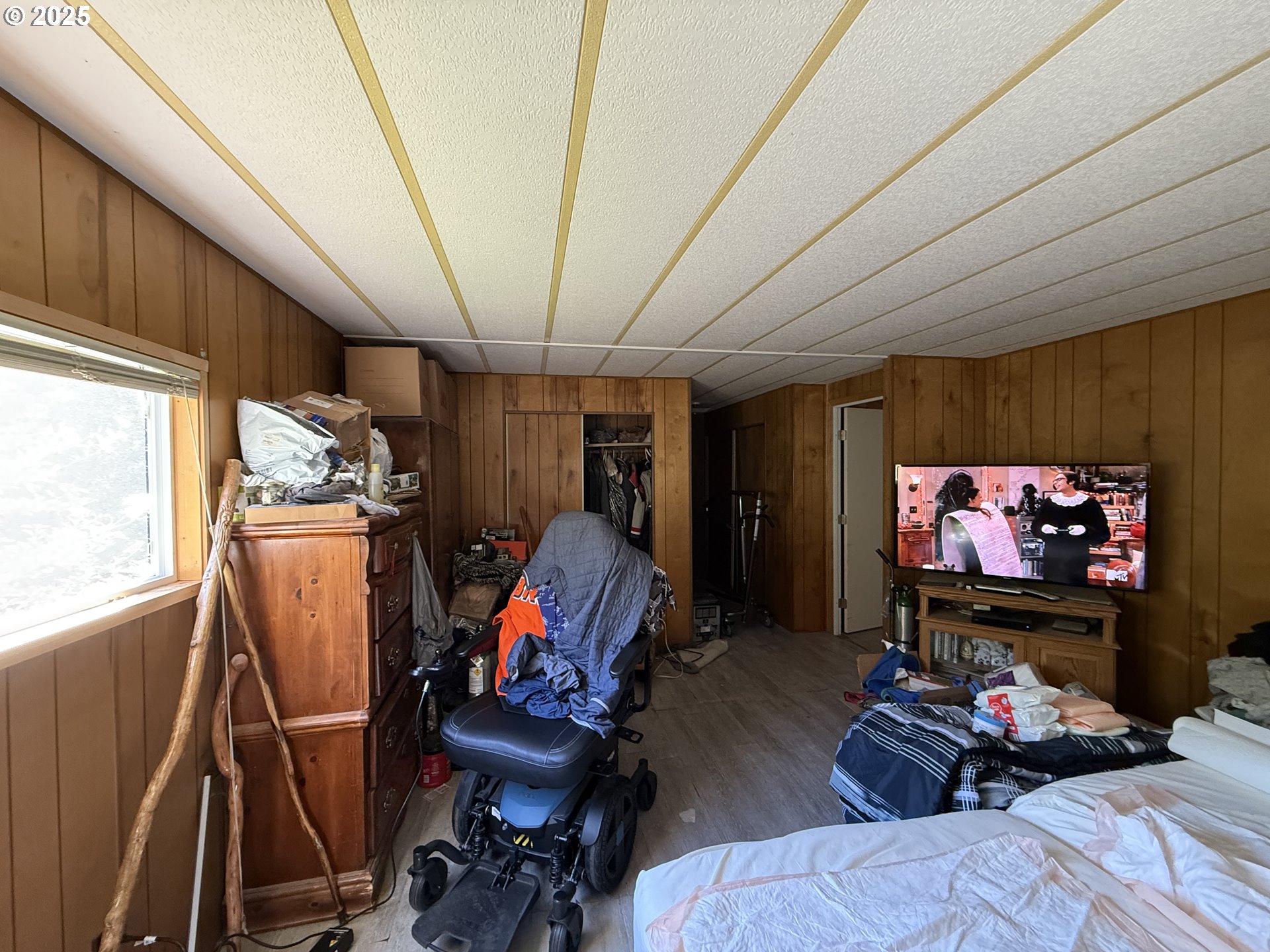 16391 Highway 101, Unit 5 Brookings, OR 97415 - Photo 15 of 27 a living room with furniture a flat screen tv and a window