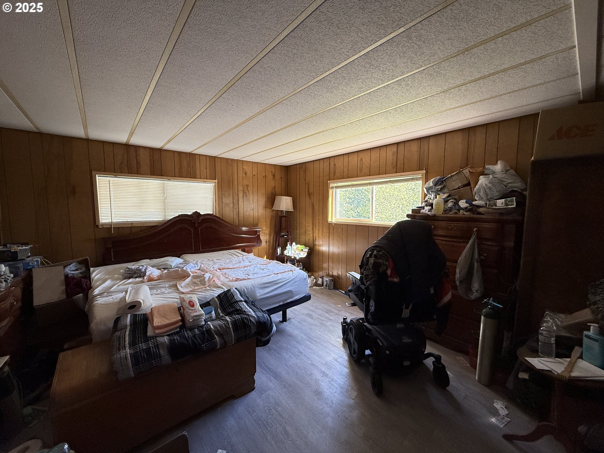 16391 Highway 101, Unit 5 Brookings, OR 97415 - Photo 16 of 27 a bedroom with bed chair and window