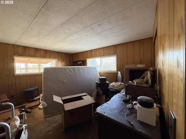 a room with furniture pool table and window