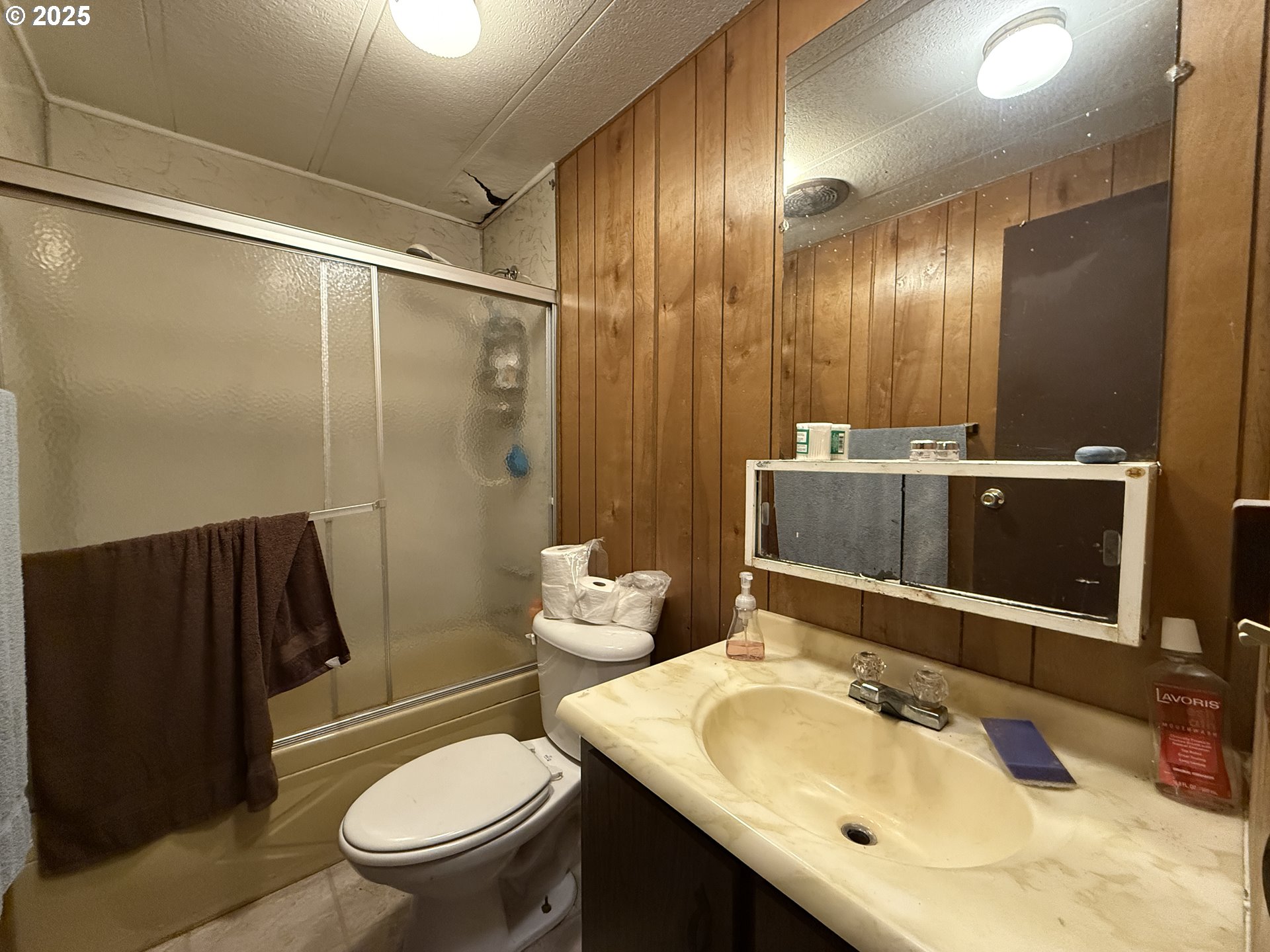16391 Highway 101, Unit 5 Brookings, OR 97415 - Photo 25 of 27 a bathroom with a sink toilet and shower