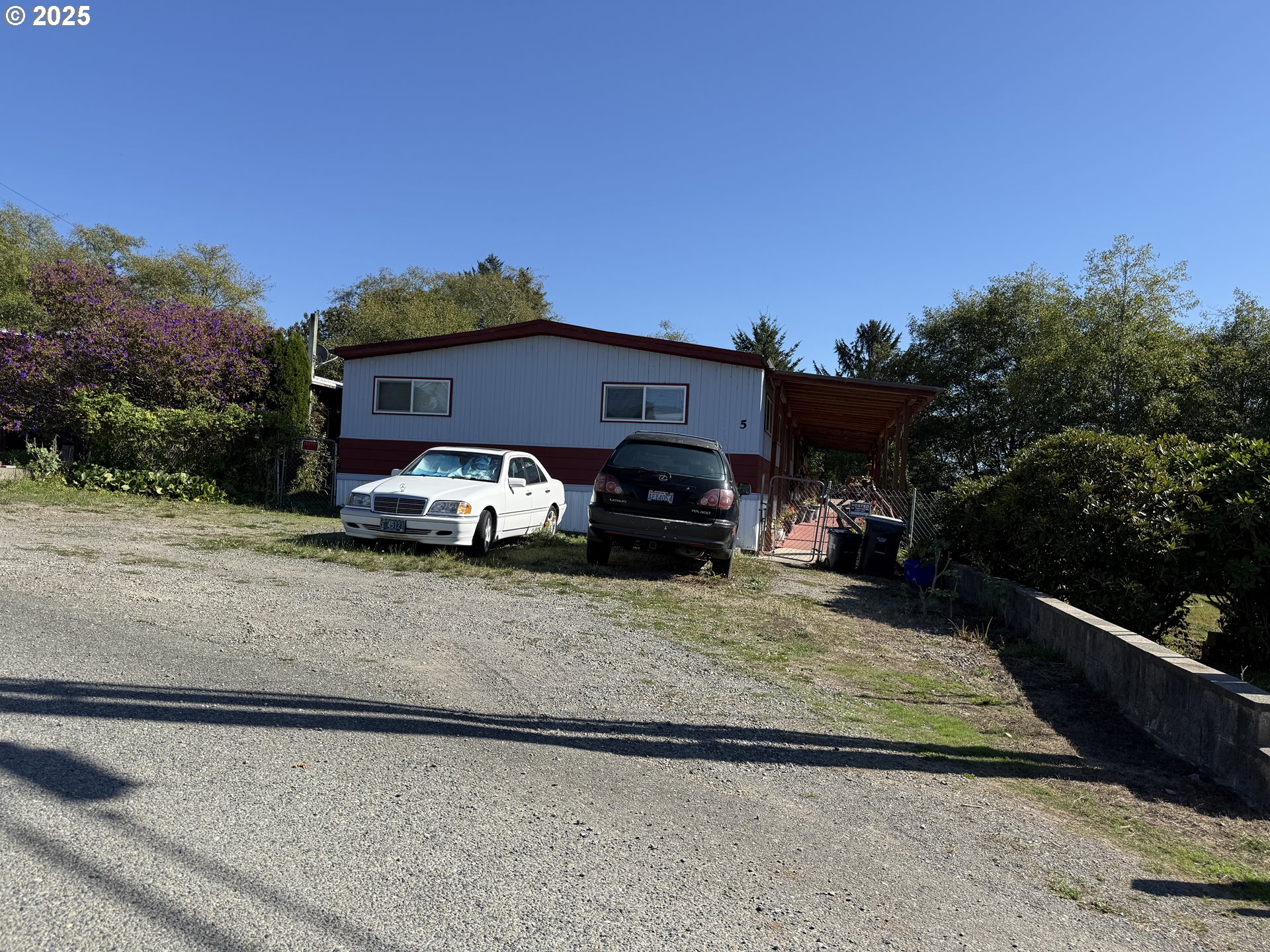 16391 Highway 101, Unit 5 Brookings, OR 97415 - Photo 3 of 27 a front view of a house with a yard