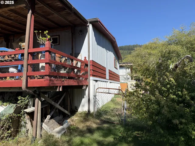 a view of a house with wooden stairs