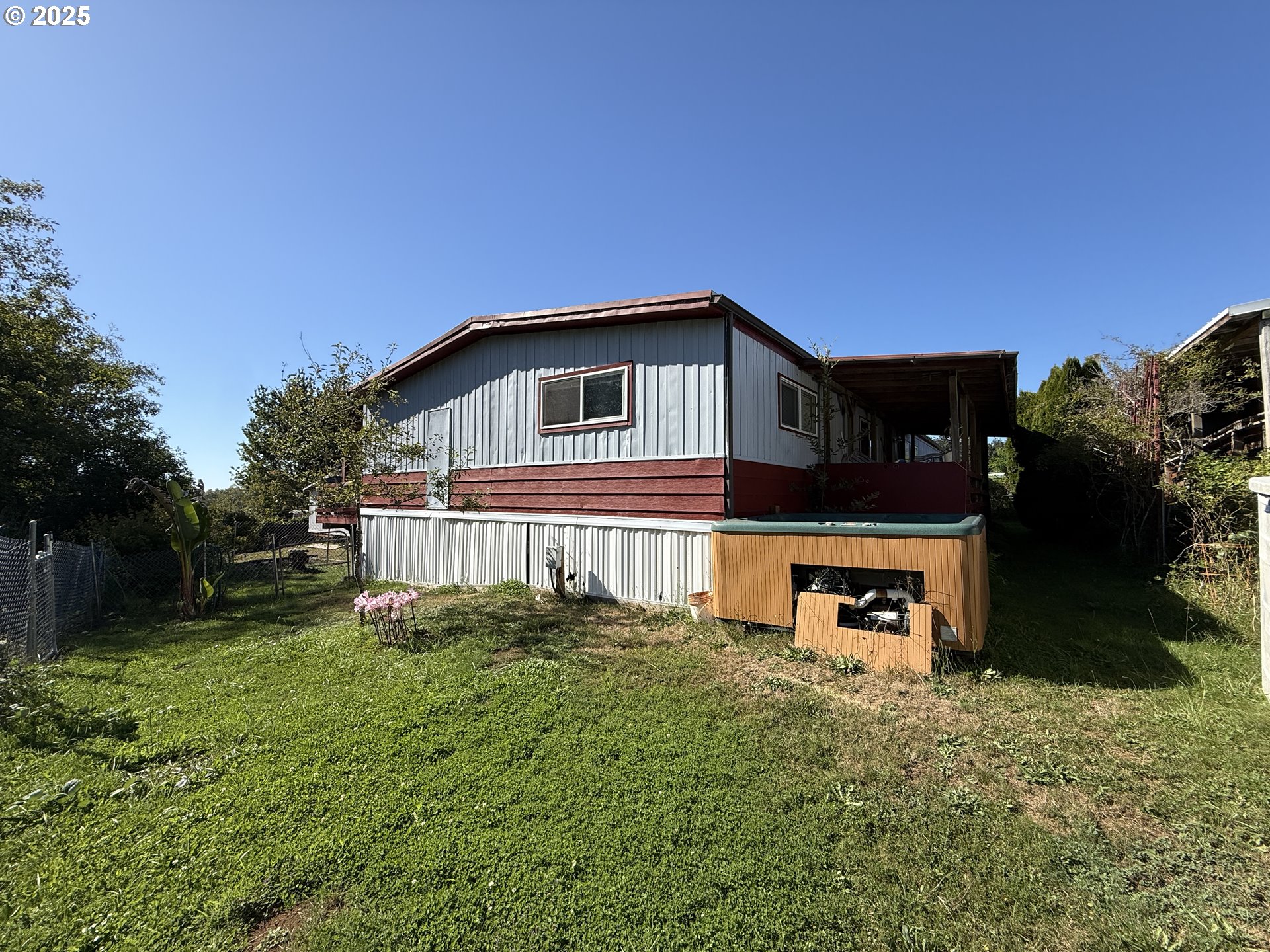 16391 Highway 101, Unit 5 Brookings, OR 97415 - Photo 7 of 27 a front view of a house with a yard