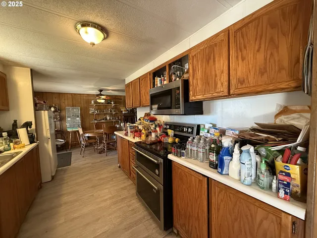 a living room with lots of furniture and gym equipment