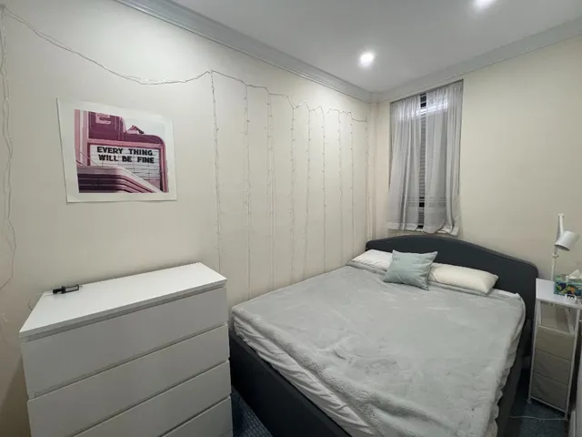 a bedroom with a bed and a cabinets