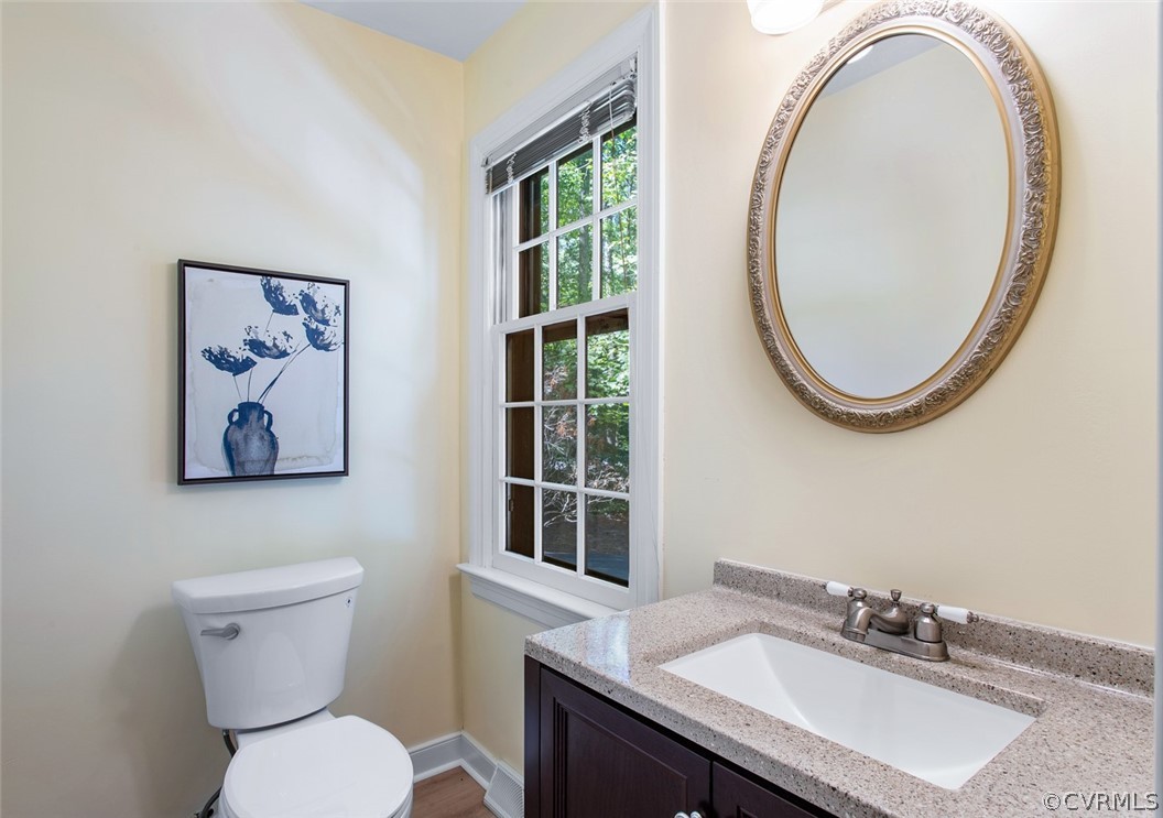 4000 Poplar Grove Road Midlothian, VA 23112 - Photo 24 of 42 a bathroom with a toilet a sink and a mirror