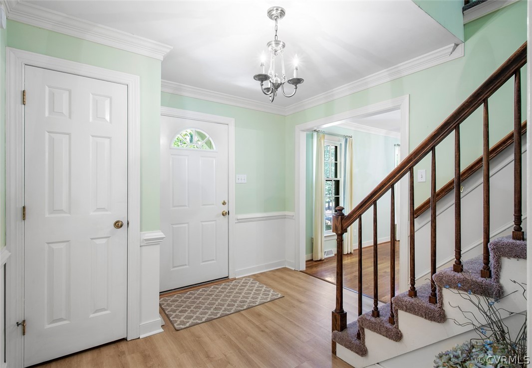 4000 Poplar Grove Road Midlothian, VA 23112 - Photo 5 of 42 a view of a hallway with wooden floor and staircase