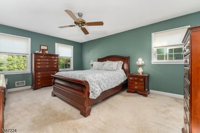 a bedroom with a bed and a tv