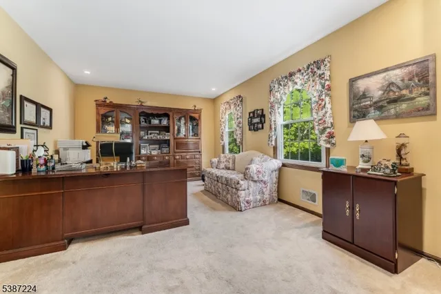 a bed room with furniture and a large window