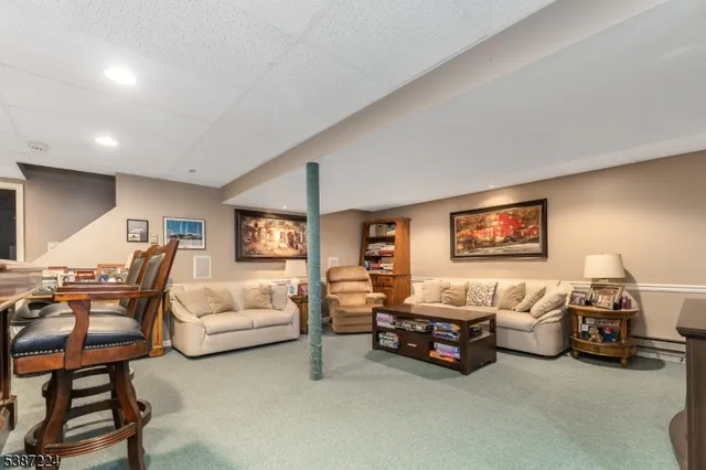 a spacious bedroom with a bed and a couch