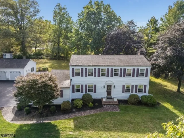 a aerial view of a house with a yard