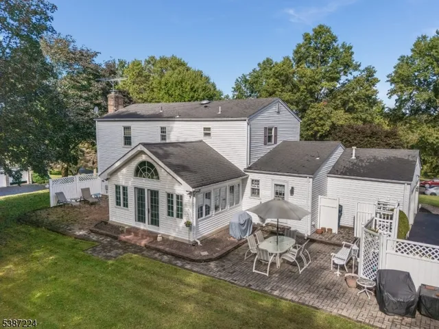 a view of house with a yard