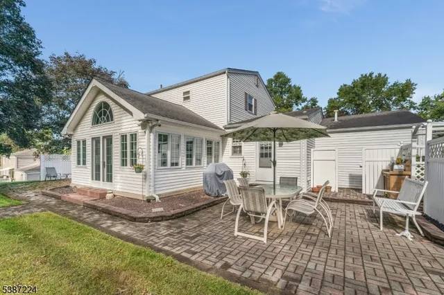 a patio area with table and chairs