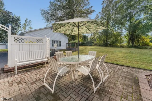 a patio with table and chairs