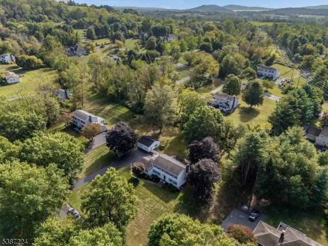 an aerial view of houses with yard