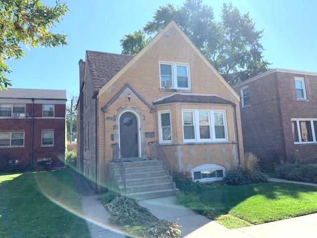 10931 South Artesian Avenue, Unit 2F Chicago, IL 60655 - Photo 1 of 11 a front view of a house with garden