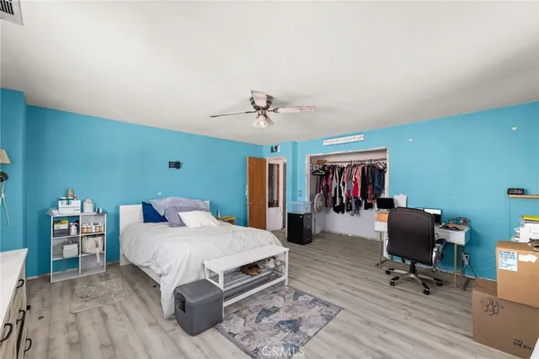 a bedroom with furniture and a window