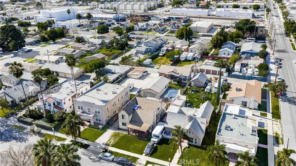 an aerial view of a house with a mountain