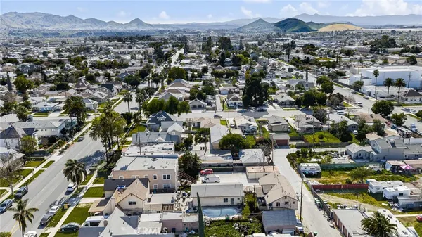 an aerial view of houses with outdoor space