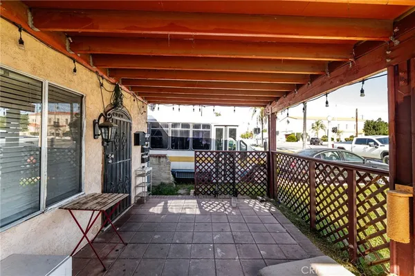 a view of a porch with furniture and shower