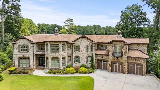 a living room with furniture a window and a flat screen tv
