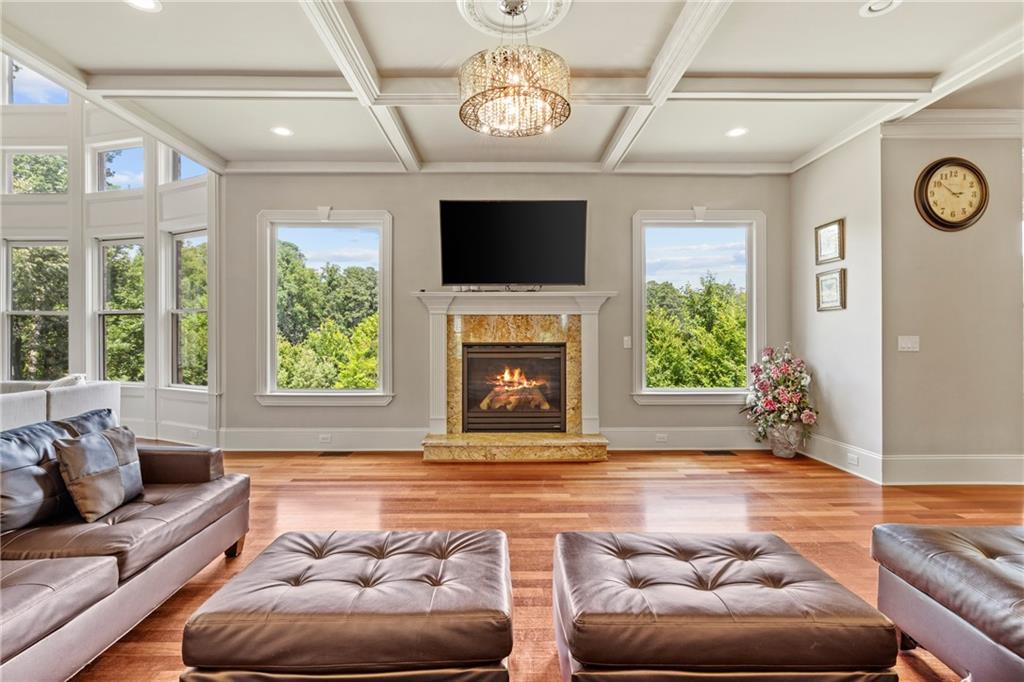 2267 Echo Trail Northeast Atlanta, GA 30345 - Photo 17 of 78 a living room with furniture a flat screen tv and a fireplace