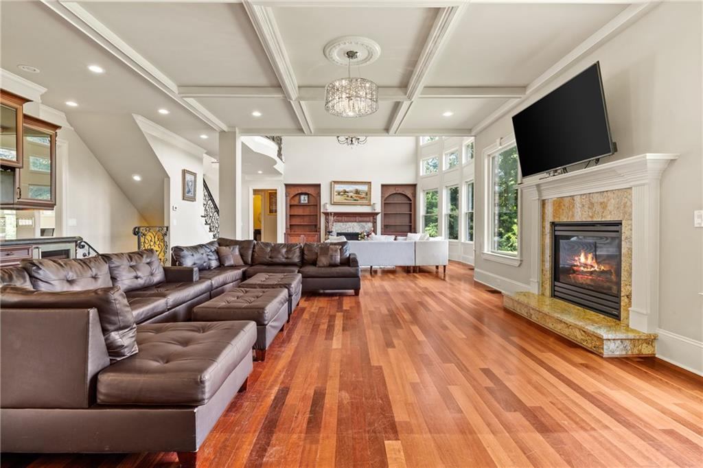 2267 Echo Trail Northeast Atlanta, GA 30345 - Photo 18 of 78 a living room with furniture a flat screen tv and a fireplace