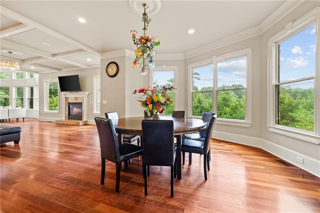 2267 Echo Trail Northeast Atlanta, GA 30345 - Photo 22 of 78 a view of a dining room with furniture a chandelier and wooden floor