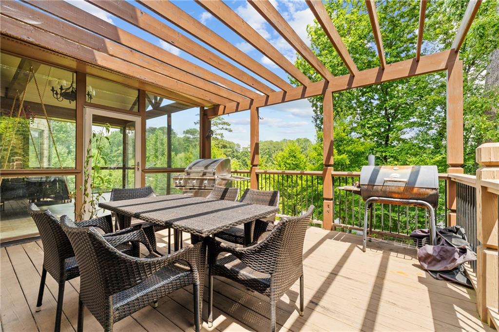 2267 Echo Trail Northeast Atlanta, GA 30345 - Photo 24 of 78 a view of a patio with a table chairs and a backyard