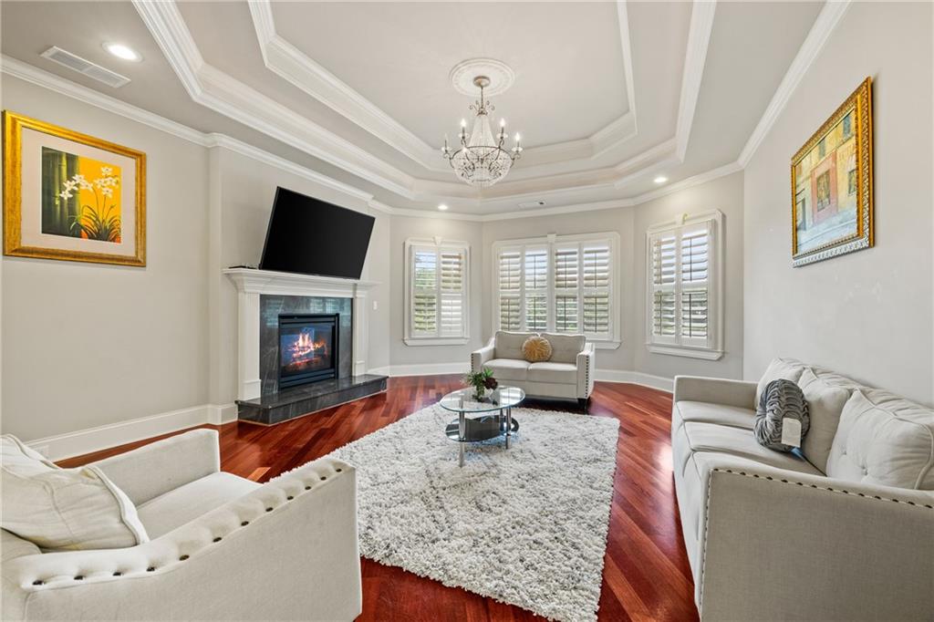 2267 Echo Trail Northeast Atlanta, GA 30345 - Photo 32 of 78 a living room with furniture a flat screen tv and a fireplace
