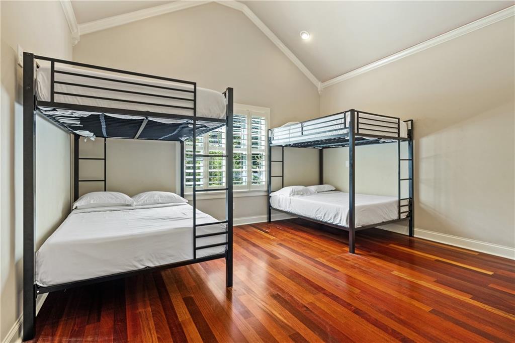 2267 Echo Trail Northeast Atlanta, GA 30345 - Photo 46 of 78 a bedroom with a bed and a wooden floor