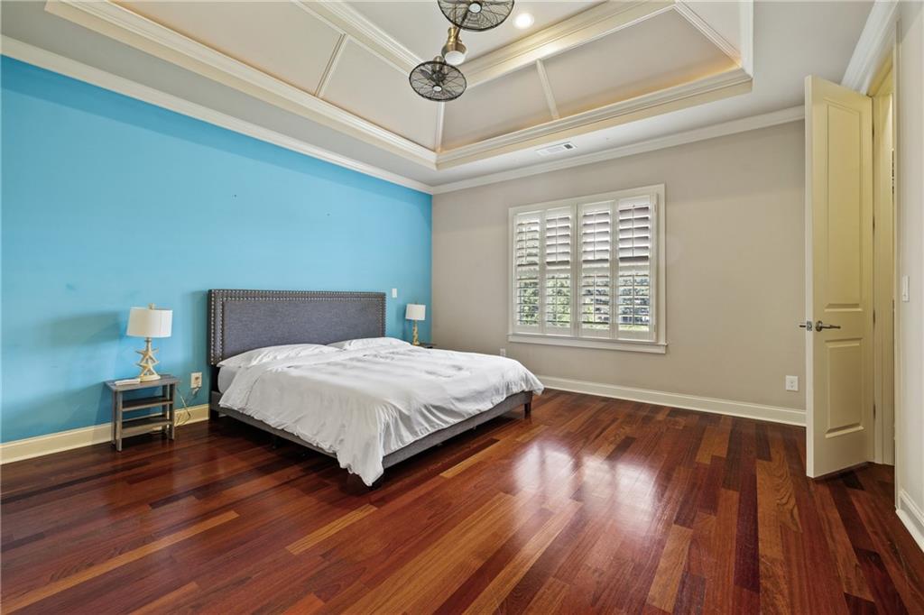 2267 Echo Trail Northeast Atlanta, GA 30345 - Photo 49 of 78 a bedroom with a bed and wooden floor