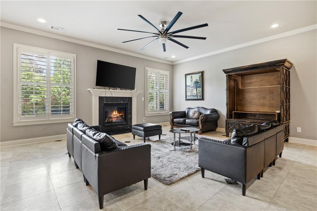 2267 Echo Trail Northeast Atlanta, GA 30345 - Photo 56 of 78 a living room with furniture and a flat screen tv